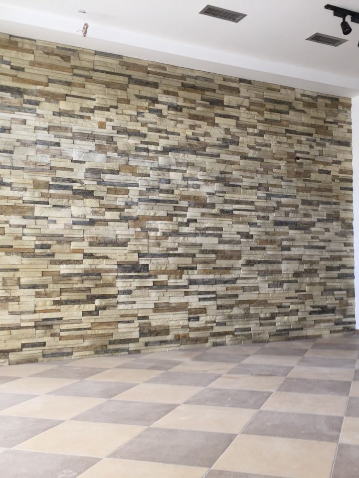 Wall finished with cast wood-look concrete panels