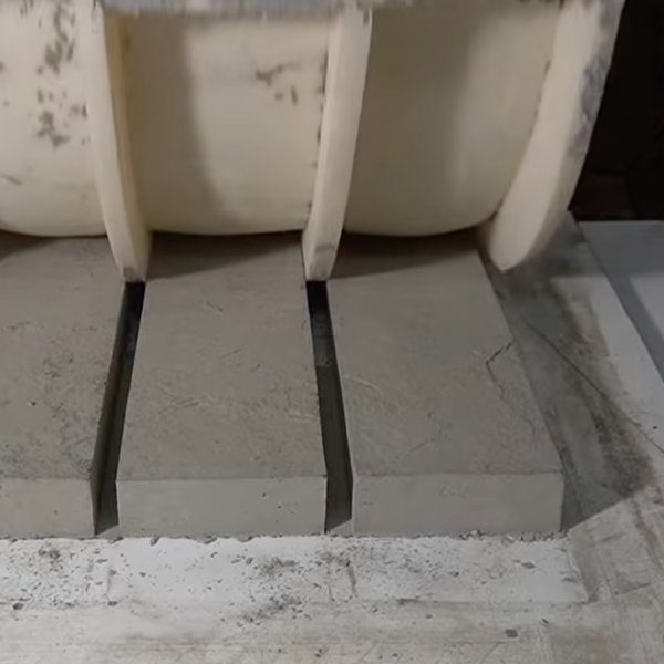 GlobMarble polyurethane mold lifted off freshly cast concrete pieces